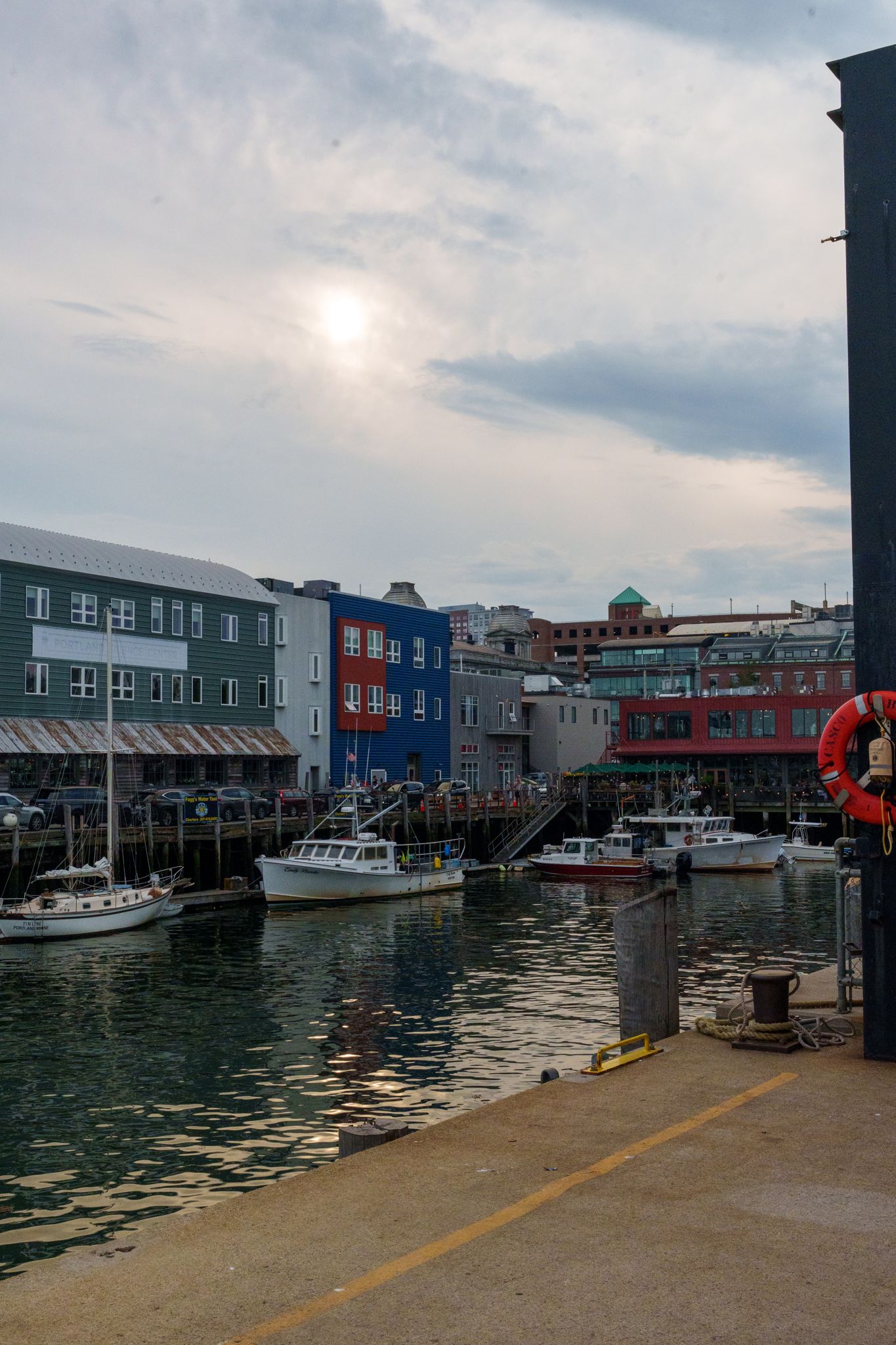 Lobster boats moored below the colored buildings of Portland's waterfront